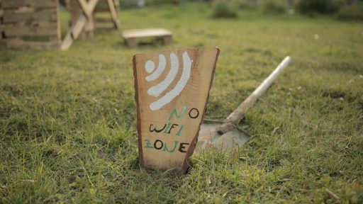 brown wooden i love you print board on green grass during daytime